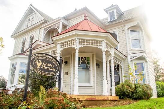 Victorian house with a wraparound porch that is home to the Legacy Museum of African American History in Lynchburg