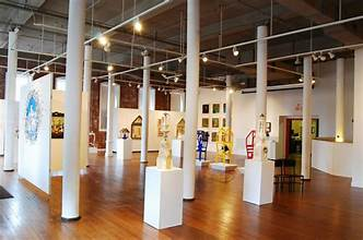 Gallery interior with white columns and artwork on display at Riverviews Artspace in Lynchburg